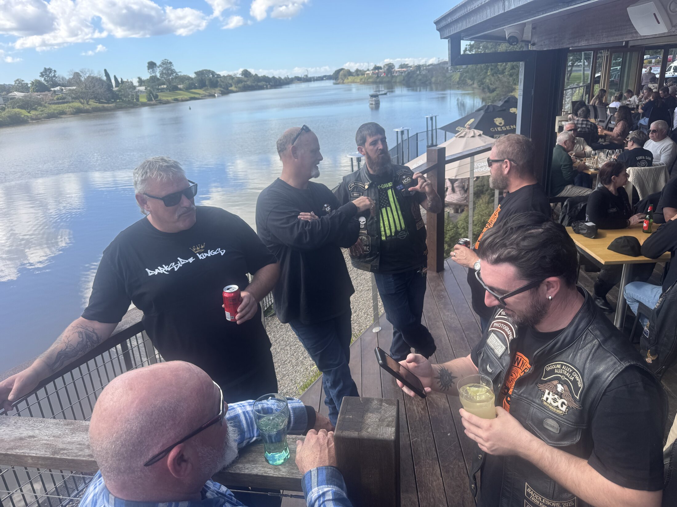 Riders gathered beside the water during the Sunday ride home