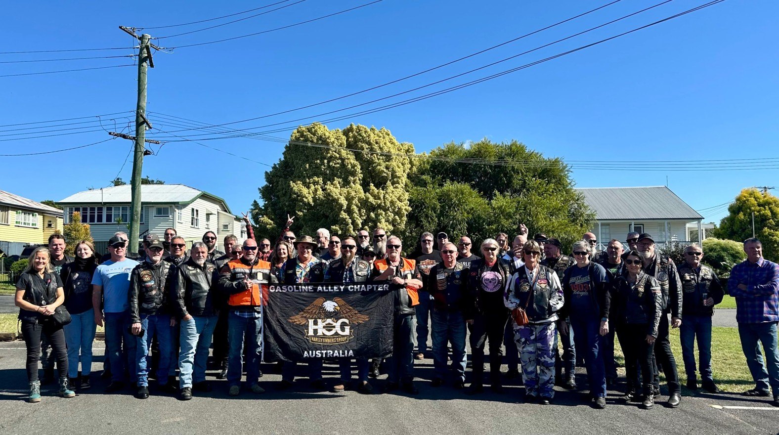 Gasoline Alley Chapter participants gathered behind the chapter banner during the May 2024 Double Shot Ride