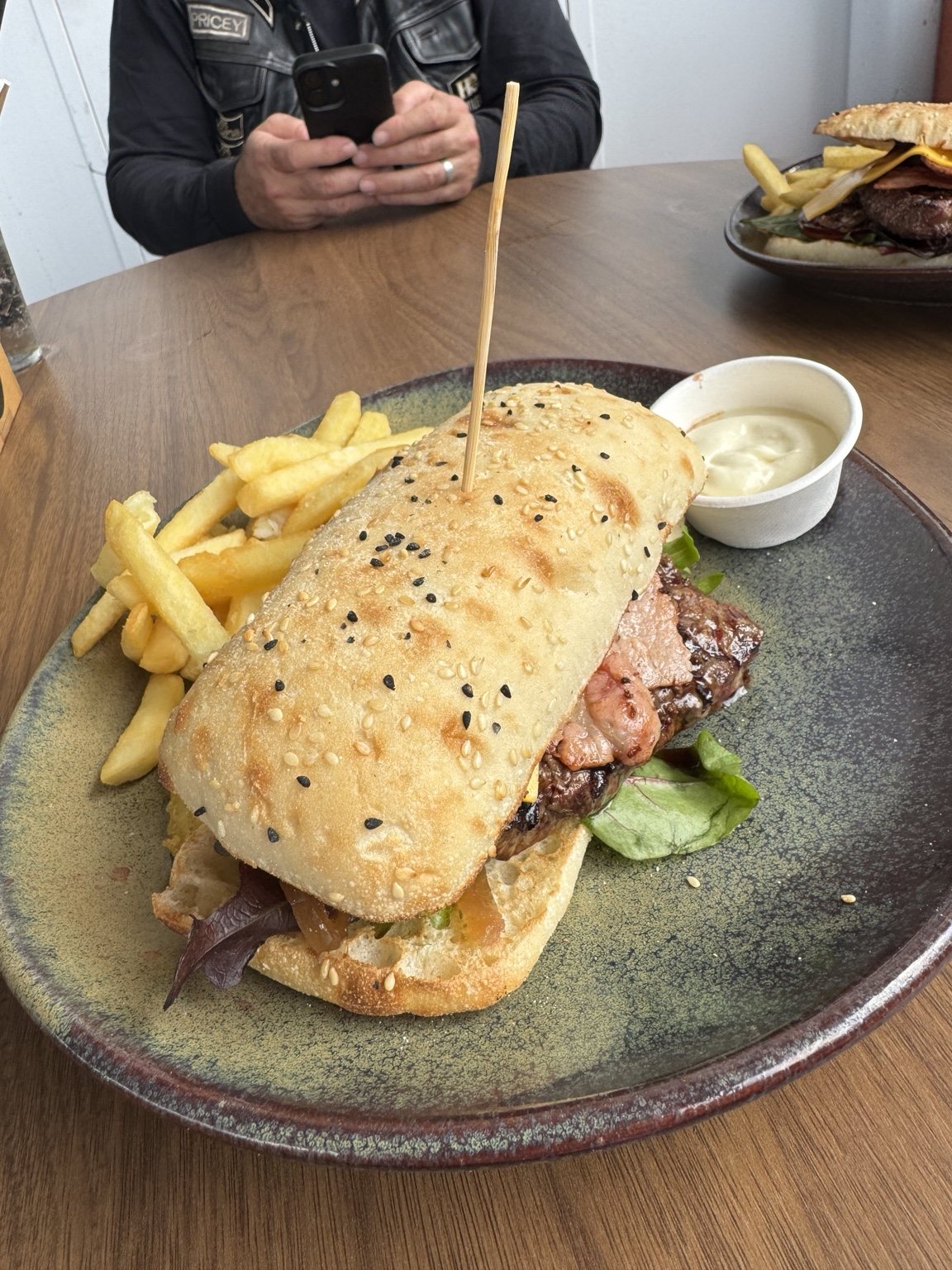 Steak and bacon burger with chips served during the ride lunch stop