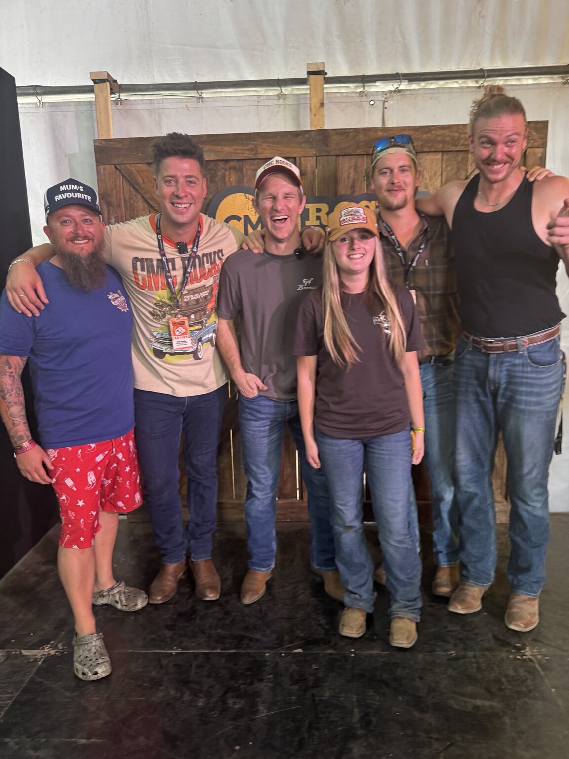 Shane and Zoe posing with performers at CMC Rocks