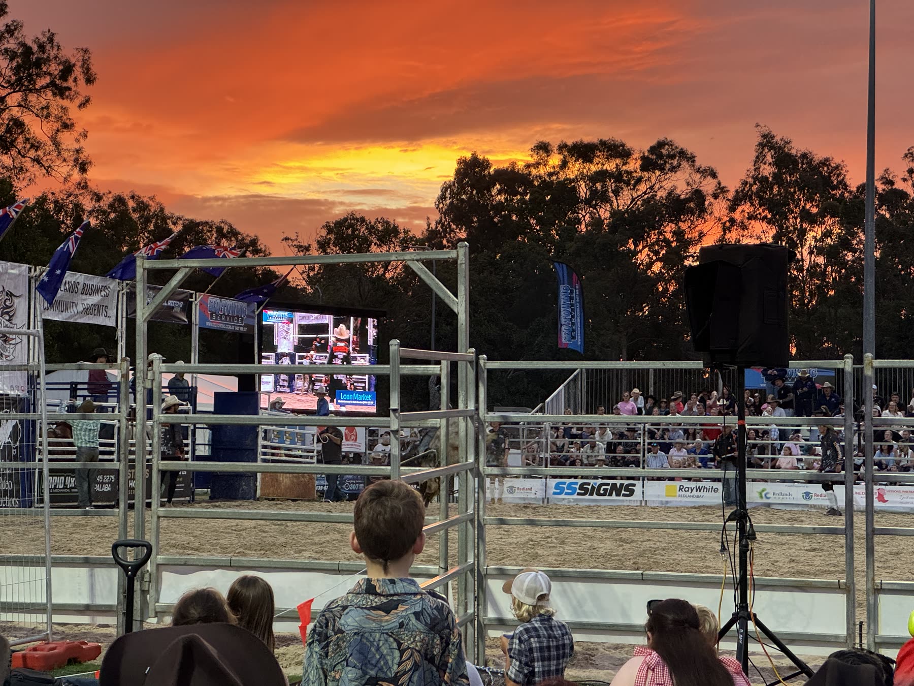 Grass Roots Rodeo arena beneath the sunset at Pinkland Park