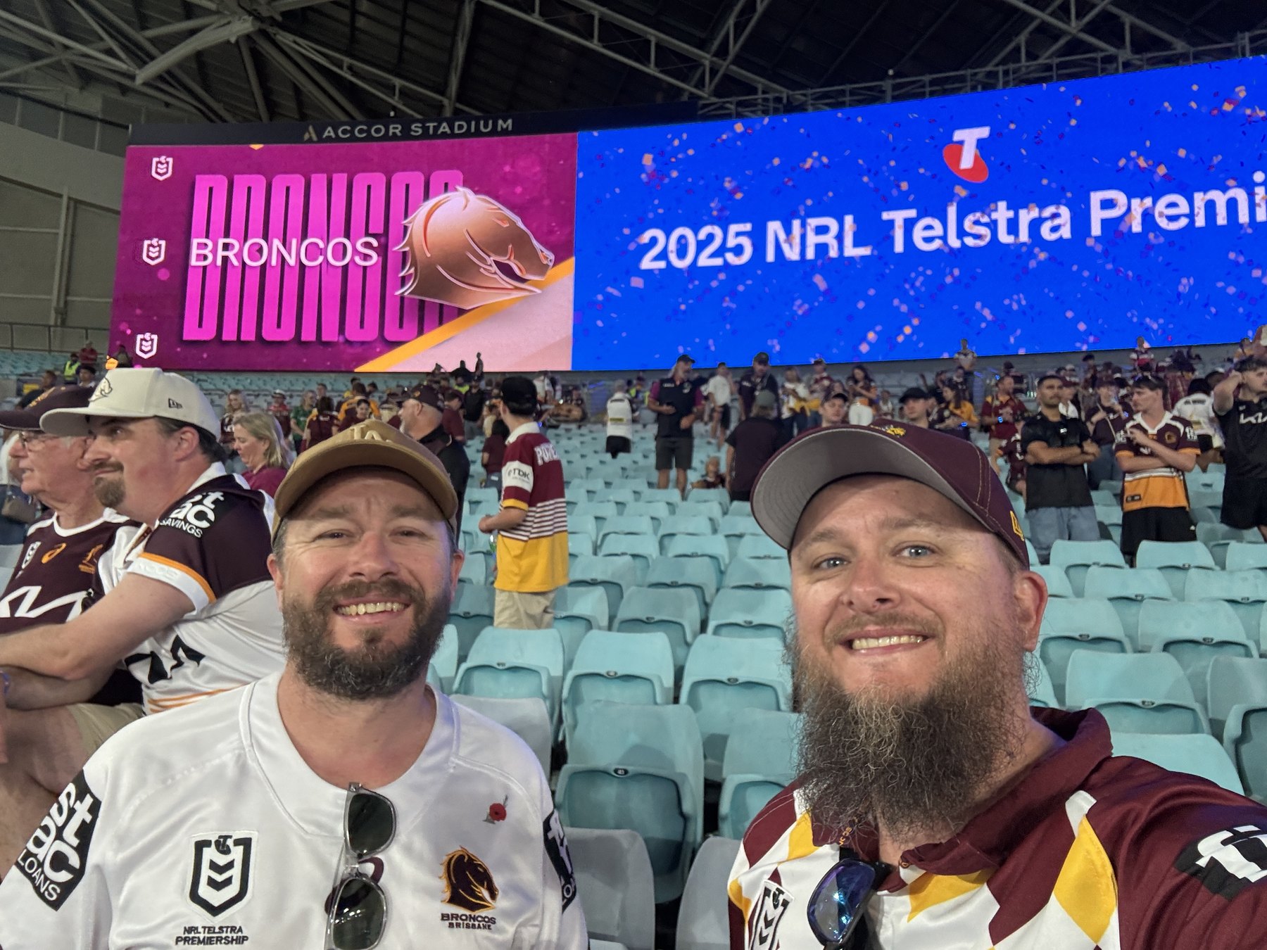 Shane and a mate celebrating the Brisbane Broncos' 2025 premiership at Accor Stadium