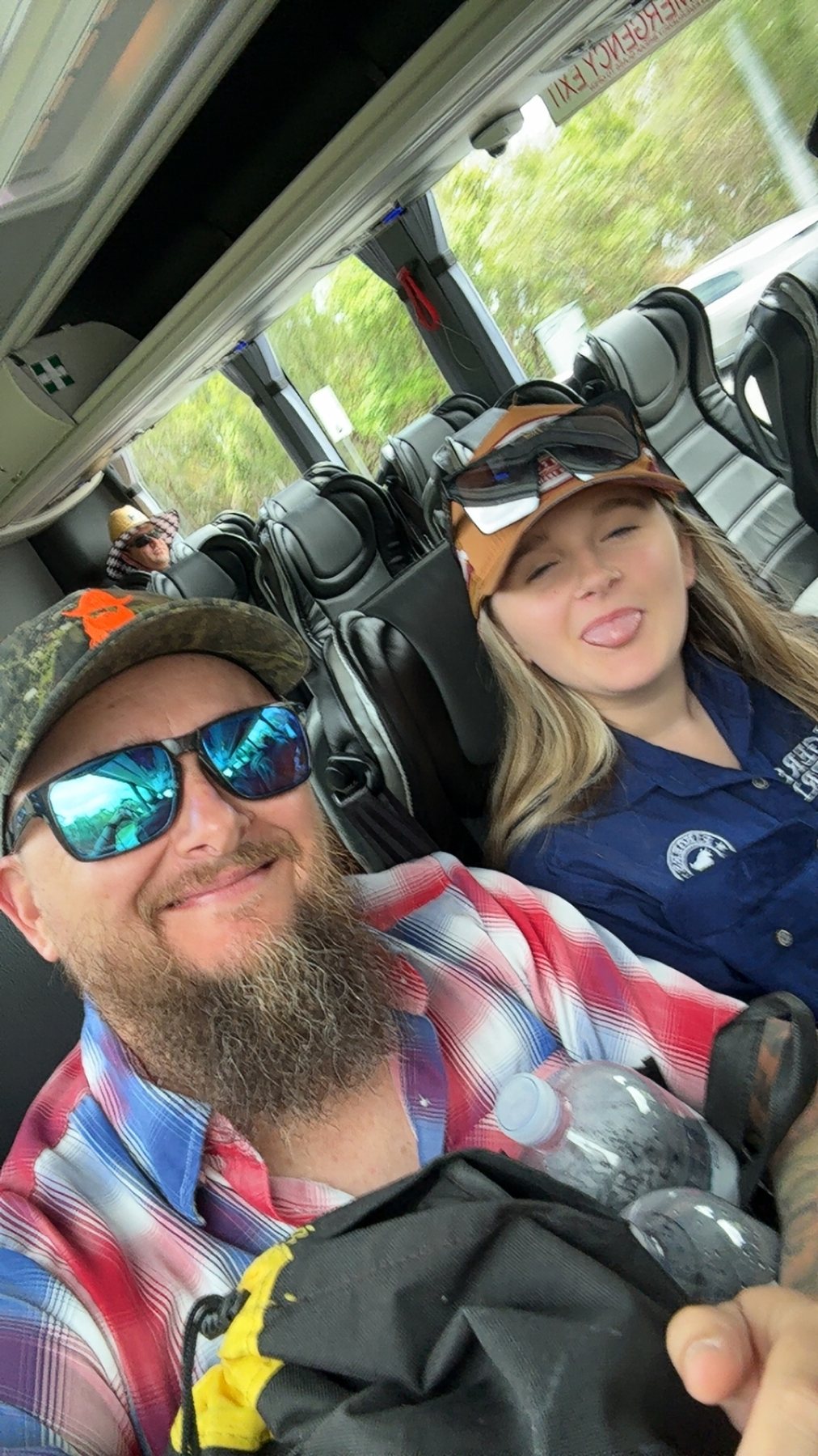 Shane and Zoe travelling aboard the festival shuttle bus