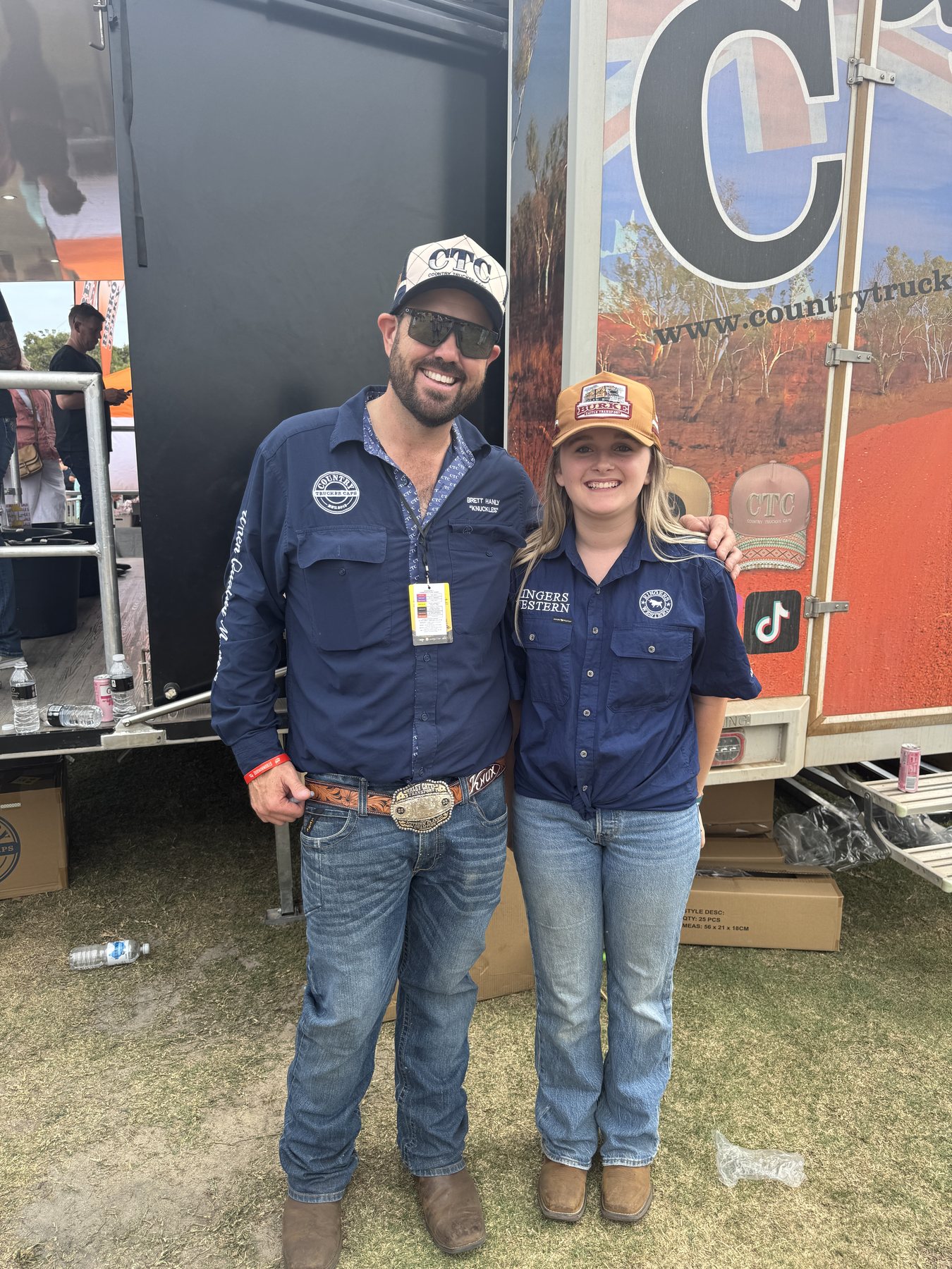 Zoe standing with Knuckles from Country Trucker Caps